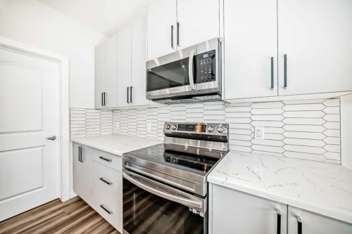 105 Creekside Way Sw, Calgary, AB - Indoor Photo Showing Kitchen