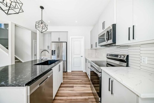 105 Creekside Way Sw, Calgary, AB - Indoor Photo Showing Kitchen With Stainless Steel Kitchen With Upgraded Kitchen