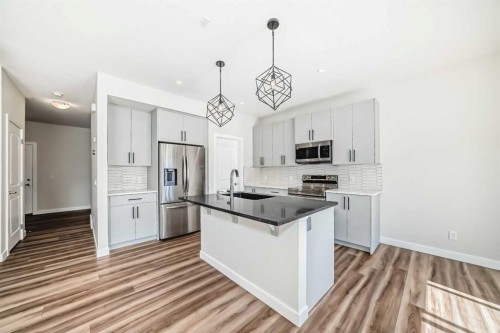 105 Creekside Way Sw, Calgary, AB - Indoor Photo Showing Kitchen With Stainless Steel Kitchen With Upgraded Kitchen