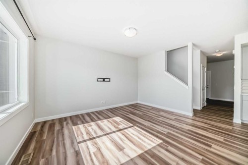 105 Creekside Way Sw, Calgary, AB - Indoor Photo Showing Other Room