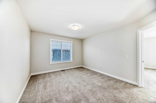 105 Creekside Way Sw, Calgary, AB - Indoor Photo Showing Other Room