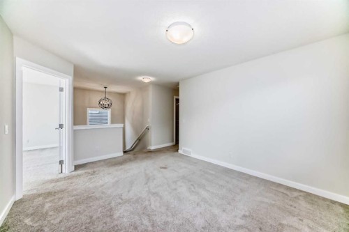 105 Creekside Way Sw, Calgary, AB - Indoor Photo Showing Other Room