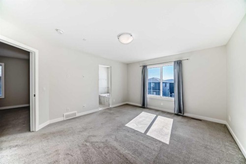 105 Creekside Way Sw, Calgary, AB - Indoor Photo Showing Other Room