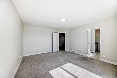 105 Creekside Way Sw, Calgary, AB - Indoor Photo Showing Other Room