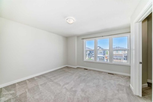 105 Creekside Way Sw, Calgary, AB - Indoor Photo Showing Other Room