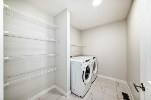 105 Creekside Way Sw, Calgary, AB - Indoor Photo Showing Laundry Room