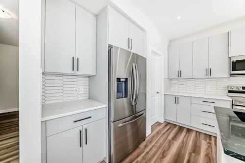 105 Creekside Way Sw, Calgary, AB - Indoor Photo Showing Kitchen With Stainless Steel Kitchen With Upgraded Kitchen