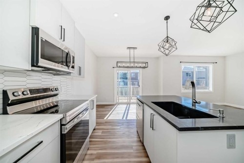 105 Creekside Way Sw, Calgary, AB - Indoor Photo Showing Kitchen With Upgraded Kitchen