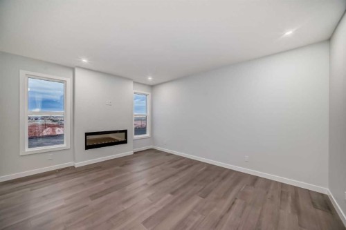 168 Cornerbrook Road Ne, Calgary, AB - Indoor Photo Showing Other Room With Fireplace