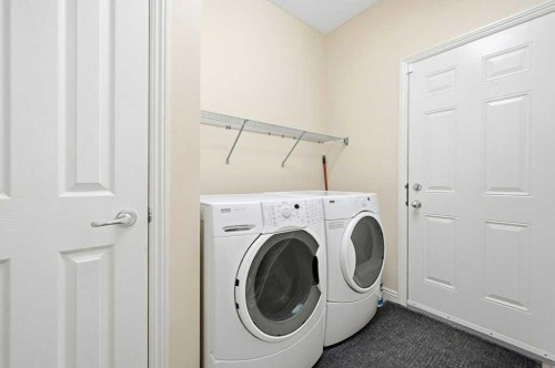 101 Panamount Manor Nw, Calgary, AB - Indoor Photo Showing Laundry Room