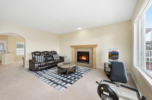 101 Panamount Manor Nw, Calgary, AB - Indoor Photo Showing Living Room With Fireplace