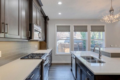 427 Canals Boulevard Sw, Airdrie, AB - Indoor Photo Showing Kitchen With Double Sink