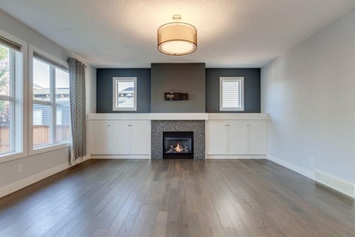 427 Canals Boulevard Sw, Airdrie, AB - Indoor Photo Showing Living Room With Fireplace