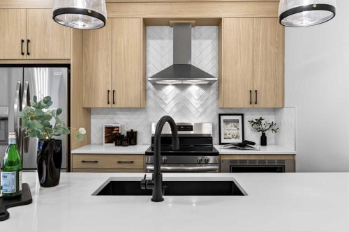 306 Alpine Boulevard, Calgary, AB - Indoor Photo Showing Kitchen With Double Sink With Upgraded Kitchen