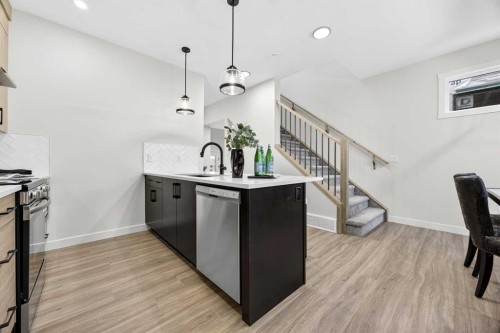 306 Alpine Boulevard, Calgary, AB - Indoor Photo Showing Kitchen With Upgraded Kitchen