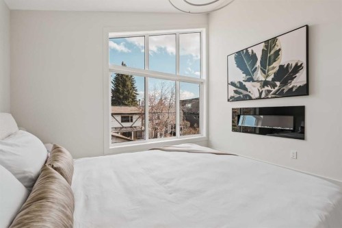 514 19 Street Nw, Calgary, AB - Indoor Photo Showing Bedroom With Fireplace