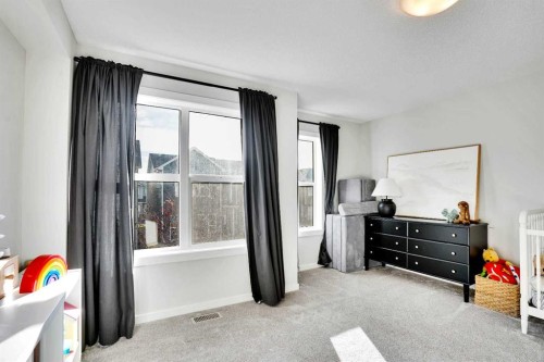 128 Cranbrook Square Se, Calgary, AB - Indoor Photo Showing Bedroom