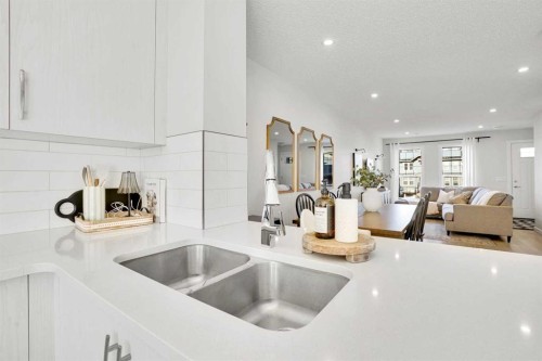 128 Cranbrook Square Se, Calgary, AB - Indoor Photo Showing Kitchen With Double Sink