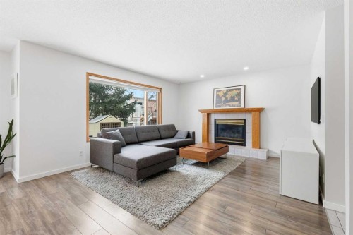 12 Citadel Close Nw, Calgary, AB - Indoor Photo Showing Living Room With Fireplace