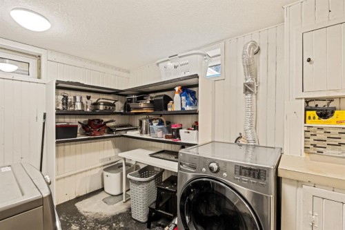 20 Calandar Road Nw, Calgary, AB - Indoor Photo Showing Laundry Room