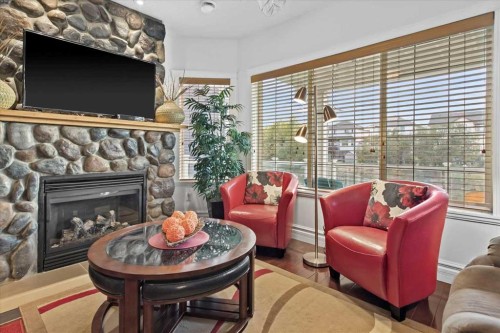 935 Bayside Drive Sw, Airdrie, AB - Indoor Photo Showing Living Room With Fireplace