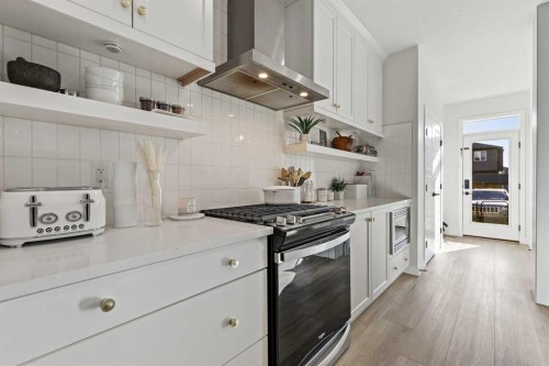 22 Wolf Creek Manor Se, Calgary, AB - Indoor Photo Showing Kitchen With Upgraded Kitchen