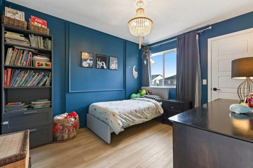 22 Wolf Creek Manor Se, Calgary, AB - Indoor Photo Showing Bedroom