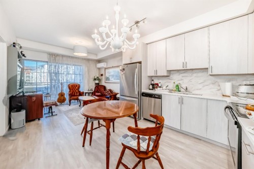 1118-298 Sage Meadows Park Nw, Calgary, AB - Indoor Photo Showing Kitchen With Stainless Steel Kitchen