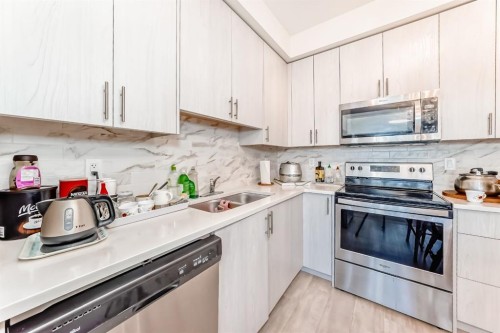 1118-298 Sage Meadows Park Nw, Calgary, AB - Indoor Photo Showing Kitchen With Stainless Steel Kitchen With Double Sink