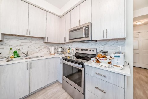 1118-298 Sage Meadows Park Nw, Calgary, AB - Indoor Photo Showing Kitchen