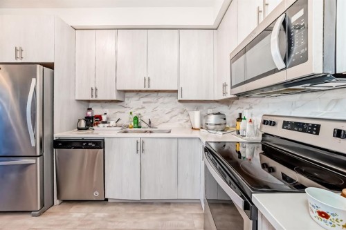 1118-298 Sage Meadows Park Nw, Calgary, AB - Indoor Photo Showing Kitchen With Stainless Steel Kitchen