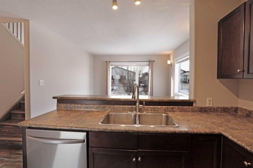 322 17 Street East, Brooks, AB - Indoor Photo Showing Kitchen With Double Sink