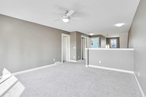 157 Rainbow Falls Boulevard, Chestermere, AB - Indoor Photo Showing Other Room