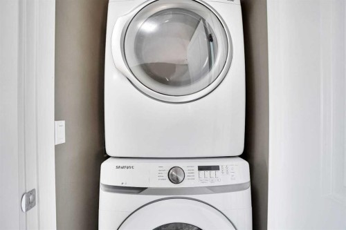 157 Rainbow Falls Boulevard, Chestermere, AB - Indoor Photo Showing Laundry Room