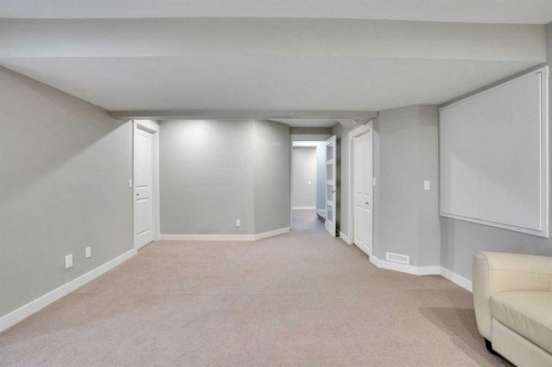 157 Rainbow Falls Boulevard, Chestermere, AB - Indoor Photo Showing Other Room