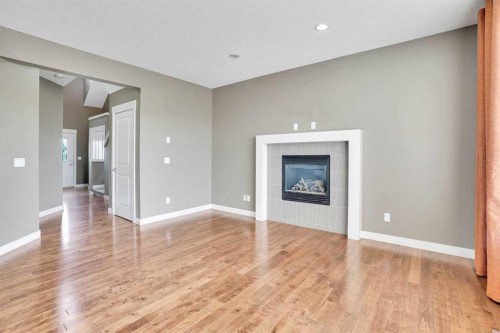 157 Rainbow Falls Boulevard, Chestermere, AB - Indoor Photo Showing Living Room With Fireplace