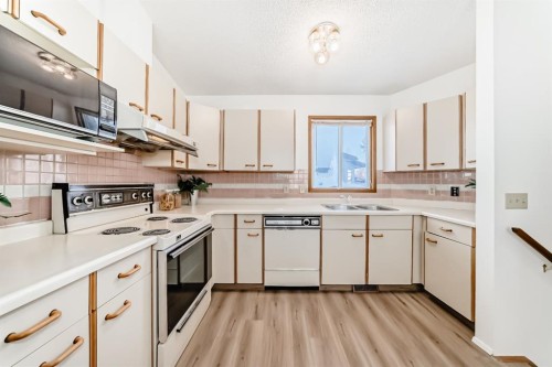20 Cedardale Hill Sw, Calgary, AB - Indoor Photo Showing Kitchen With Double Sink