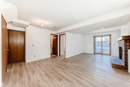 20 Cedardale Hill Sw, Calgary, AB - Indoor Photo Showing Other Room With Fireplace
