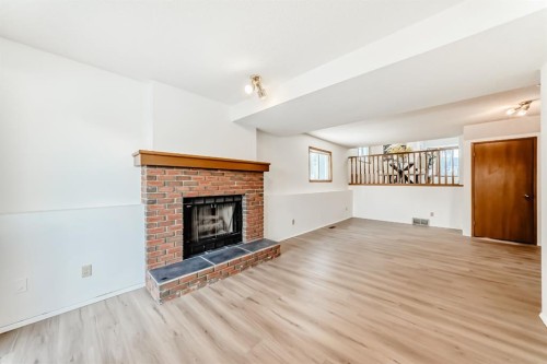 20 Cedardale Hill Sw, Calgary, AB - Indoor Photo Showing Living Room With Fireplace