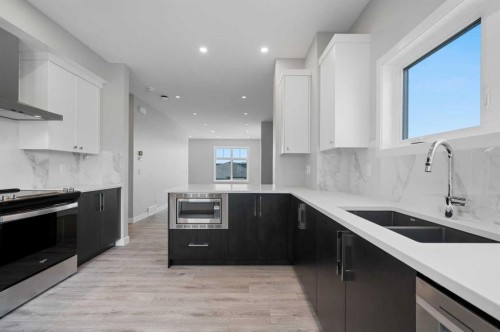 599 Mahogany Road Se, Calgary, AB - Indoor Photo Showing Kitchen With Double Sink With Upgraded Kitchen
