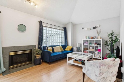 99 Inverness Park Se, Calgary, AB - Indoor Photo Showing Living Room With Fireplace