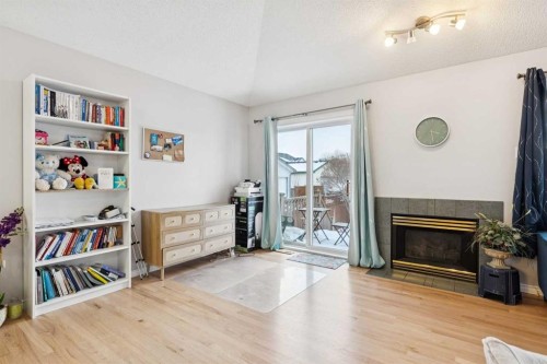 99 Inverness Park Se, Calgary, AB - Indoor Photo Showing Other Room With Fireplace
