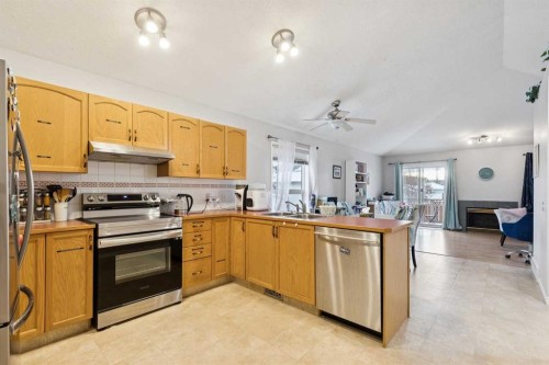 99 Inverness Park Se, Calgary, AB - Indoor Photo Showing Kitchen With Double Sink