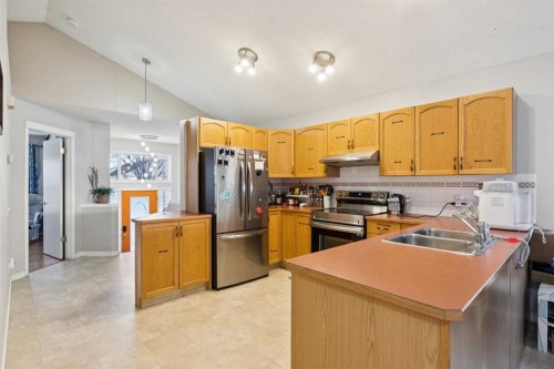 99 Inverness Park Se, Calgary, AB - Indoor Photo Showing Kitchen With Stainless Steel Kitchen With Double Sink