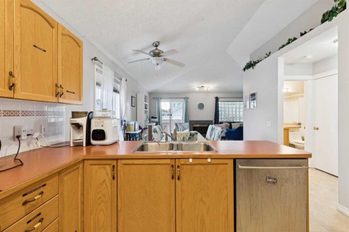 99 Inverness Park Se, Calgary, AB - Indoor Photo Showing Kitchen With Double Sink