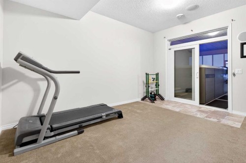 43 Ranchers Crescent, Okotoks, AB - Indoor Photo Showing Gym Room