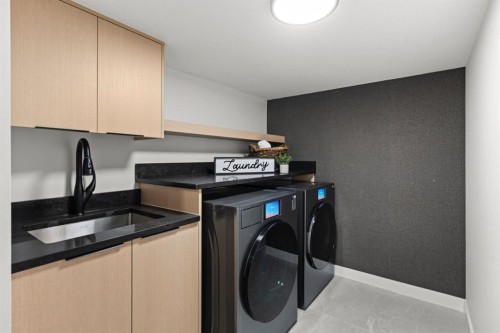 27 Glacier Drive Sw, Calgary, AB - Indoor Photo Showing Laundry Room