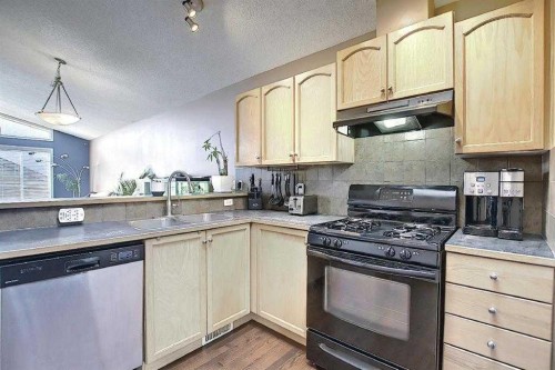 1 Prestwick Mount Se, Calgary, AB - Indoor Photo Showing Kitchen With Double Sink