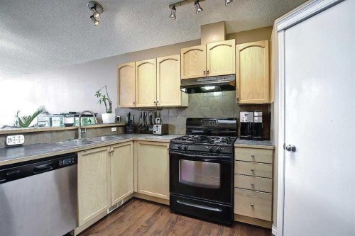 1 Prestwick Mount Se, Calgary, AB - Indoor Photo Showing Kitchen With Double Sink