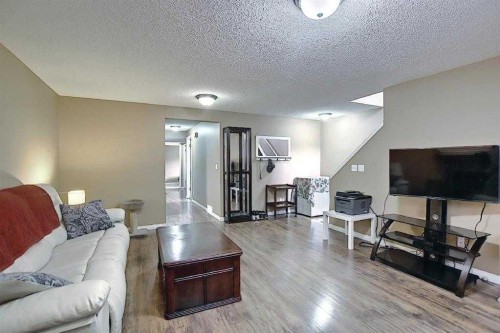 1 Prestwick Mount Se, Calgary, AB - Indoor Photo Showing Living Room